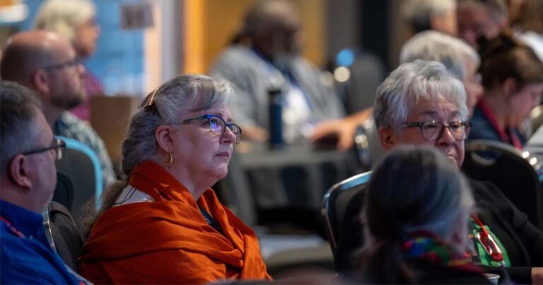 Members of General Synod listen to debate