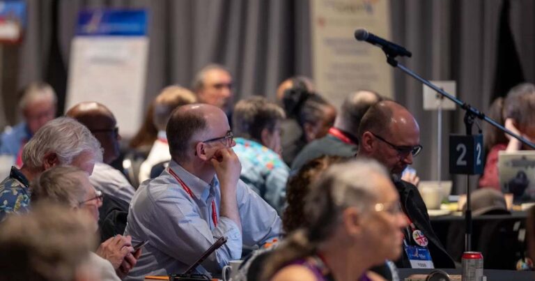 View of people listening to debate